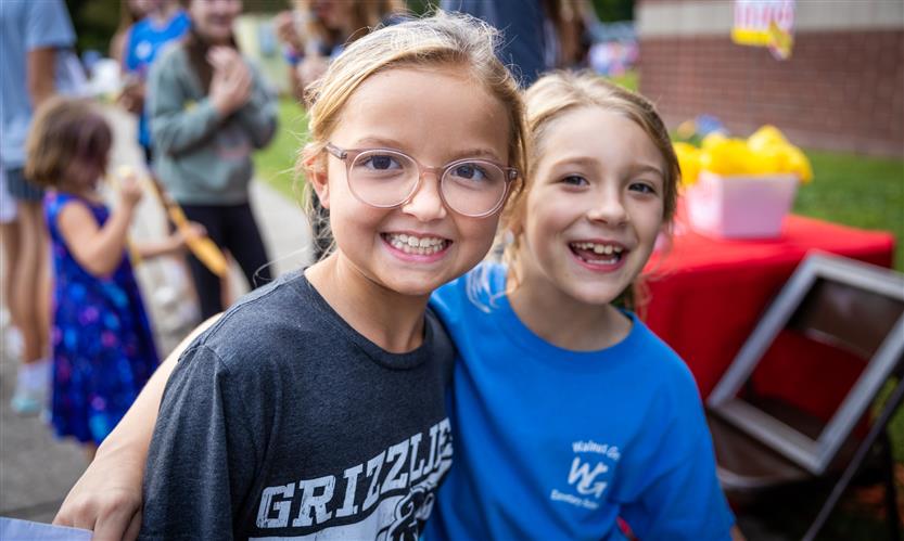 Two girls smile